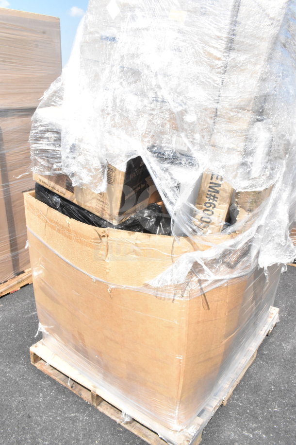 Cardboard box with shrink wrap containing brand new scratch and dent items including tongs, Moscow mule mugs, and a sink.