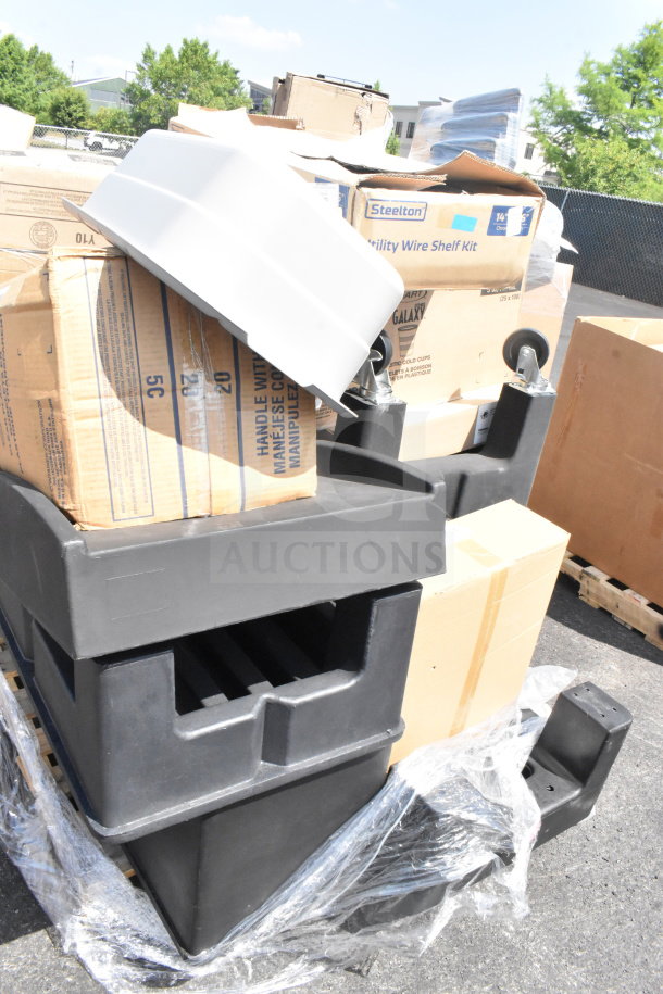 14 brand new scratch and dent black poly dunnage racks, stacked with boxes, including Steelton wire shelf kit.