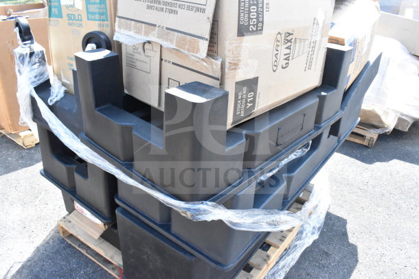 Set of 14 brand new black poly dunnage racks on pallets, still wrapped, showing minor scratches and dents.