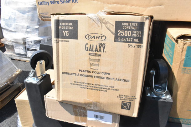 Box of Dart Conex Galaxy plastic cold cups, 2500 pieces, with black poly dunnage rack and utility wire shelf kit in background.