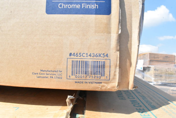 Cardboard box with barcode and text indicating manufacture for Clark Core Services, Lancaster, PA. Made in Vietnam. Box shows wear.