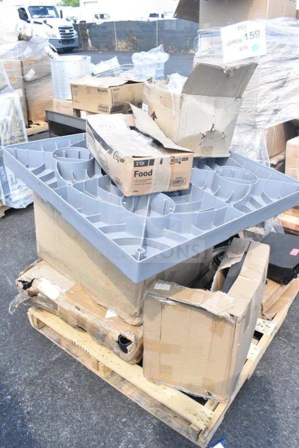 Nine new scratch and dent items on a pallet, including a replacement kettle for a popcorn machine and ice cream tub covers. Boxes show some wear.