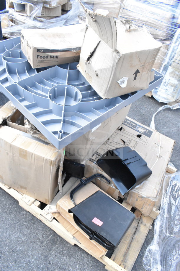 Stack of miscellaneous items including a replacement kettle for a popcorn machine and ice cream tub covers, scratch and dent condition.
