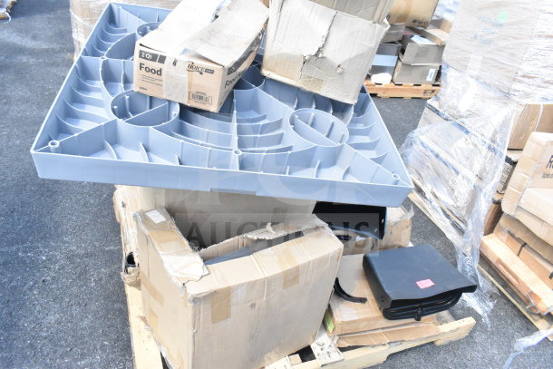 A lot of brand new scratch and dent items on pallets, includes a replacement kettle for a popcorn machine, ice cream tub covers, and assorted boxes. Some boxes are visibly damaged.