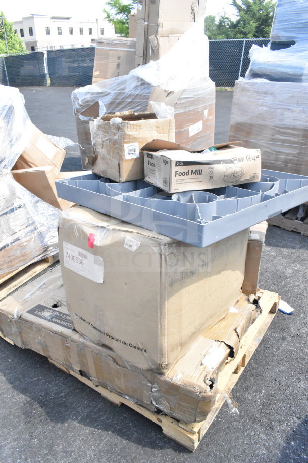 Pallet with boxed items: replacement kettle for popcorn machine, ice cream tub covers, and food mills; some packaging is damaged.