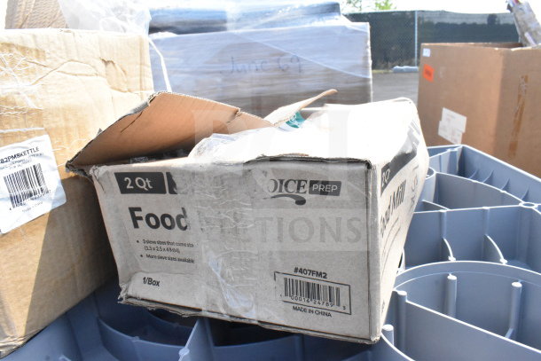 Cardboard boxes containing new scratch and dent items, including popcorn machine replacement kettle and ice cream tub covers, labeled "Choice Prep," 2 Qt food mill visible.