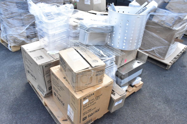 18 new scratch and dent items including tumblers, drainboard, lids, and more, stacked on a pallet. Fabri-Kal boxes visible.