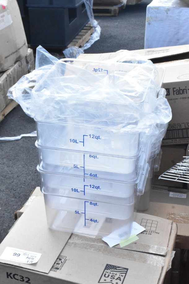 Stacked clear containers with measurement markings, plastic-wrapped, on a pallet. Includes 18 new scratch and dent items.