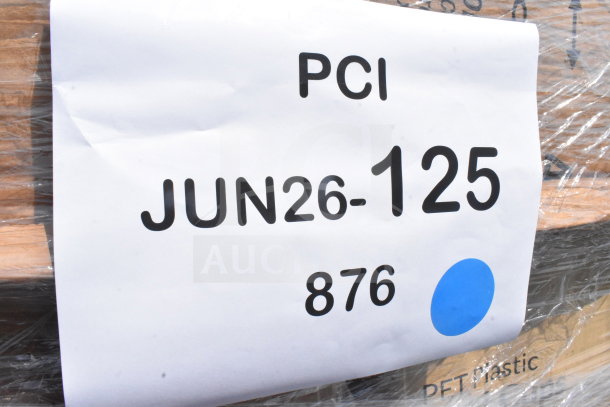 "Close-up of auction item label with 'PCI', 'JUN26-125', and '876'. Contains 18 new scratch and dent items like cups and bags."