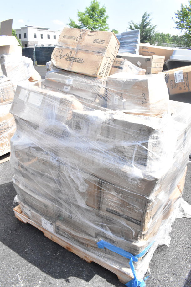 Palette of scratch and dent items, including hood filters and glasses, wrapped in plastic; boxes show wear, labels visible.