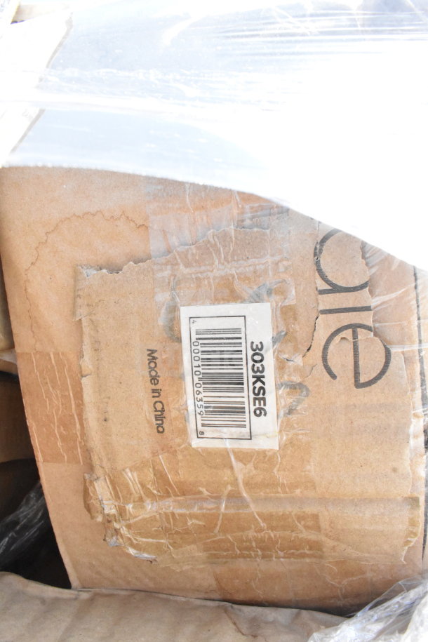 Cardboard box with a barcode marked 303KSE6 and "Made in China," wrapped in plastic. Contains scratch and dent items.