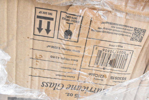Cardboard box with handling instructions and a barcode, wrapped in plastic. Box states "Made in China" and contains items like hood filters.