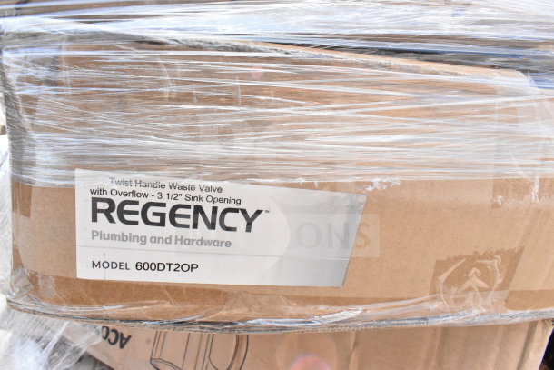 Box labeled "Regency Plumbing and Hardware," model 600DT20P. Wrapped in plastic, part of a scratch and dent auction lot.