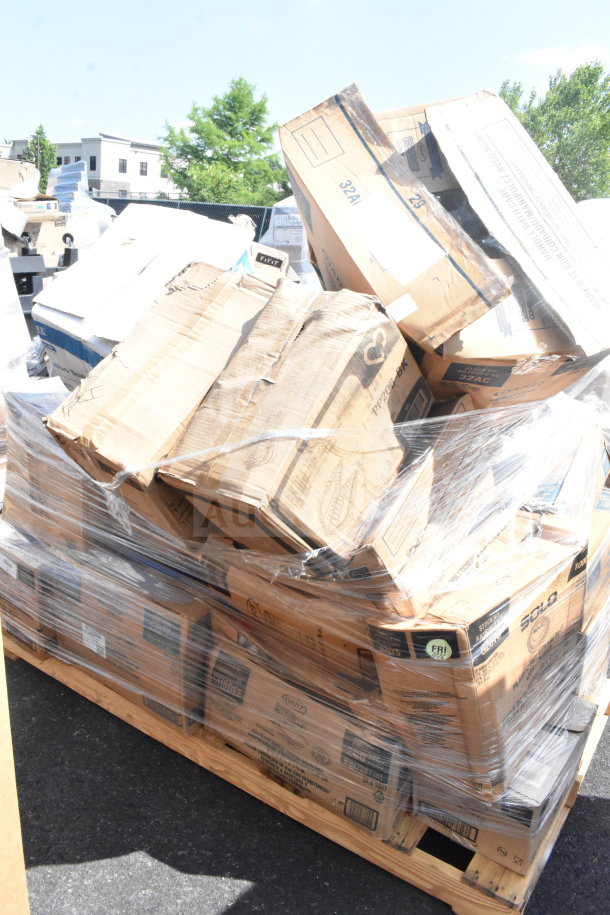 Scratch and dent items on a pallet, wrapped in plastic. Includes boxed toilet paper, lids, cold and hot cups. 26 items total.