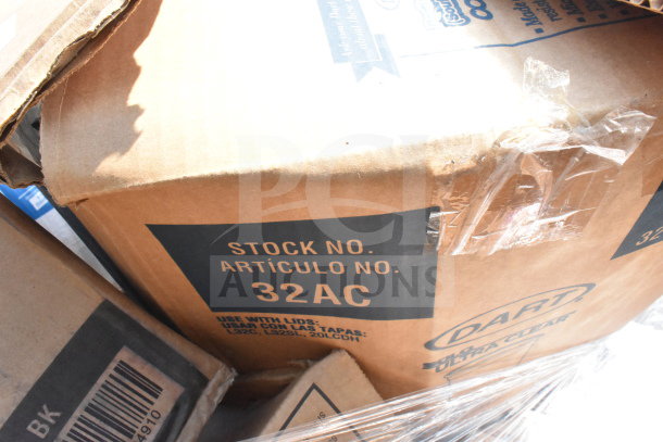 Cardboard box labeled "Stock No. 32AC" containing various scratch and dent items, including cups and lids. Brand: Dart Ultra Clear.