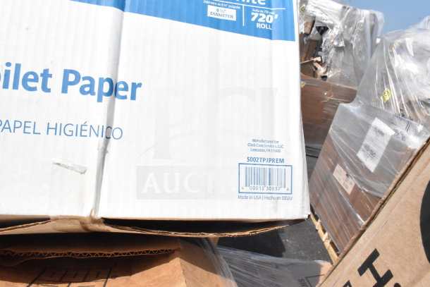 Box of toilet paper with visible labels for Clark Core Services, 720' roll, 8.5" diameter, Made in USA.