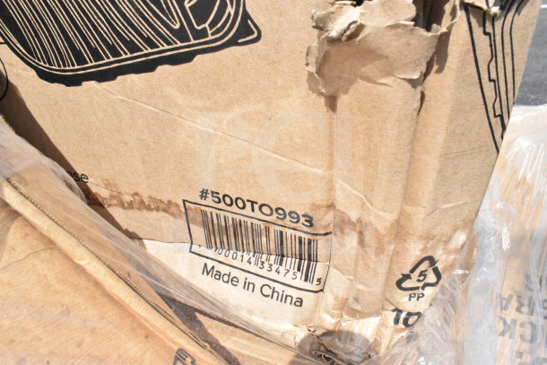 Damaged cardboard box labeled #500TO993, made in China, containing scratch and dent items like cups and lids.