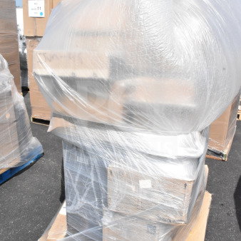 Plastic-wrapped pallet with 26 new scratch and dent items, including a cup dispenser, lid organizer, and trash can.