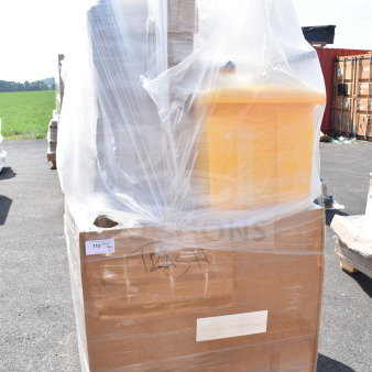 Plastic-wrapped pallet containing 13 brand new, scratch and dent items including a yellow trash can. Labeled "Trash."