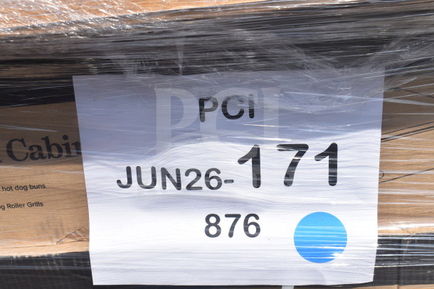 "Scratch and Dent" auction items wrapped in plastic, labeled with PCI, JUN26-171, and item number 876.