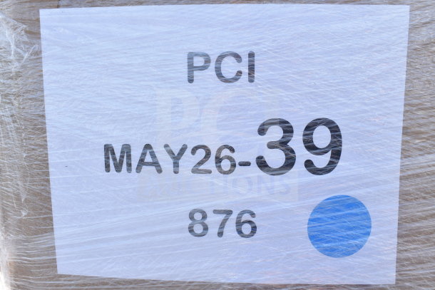 Shrink-wrapped label on auction pallet, marked "PCI MAY26-39 876" with a blue dot. Contains new scratch and dent items.