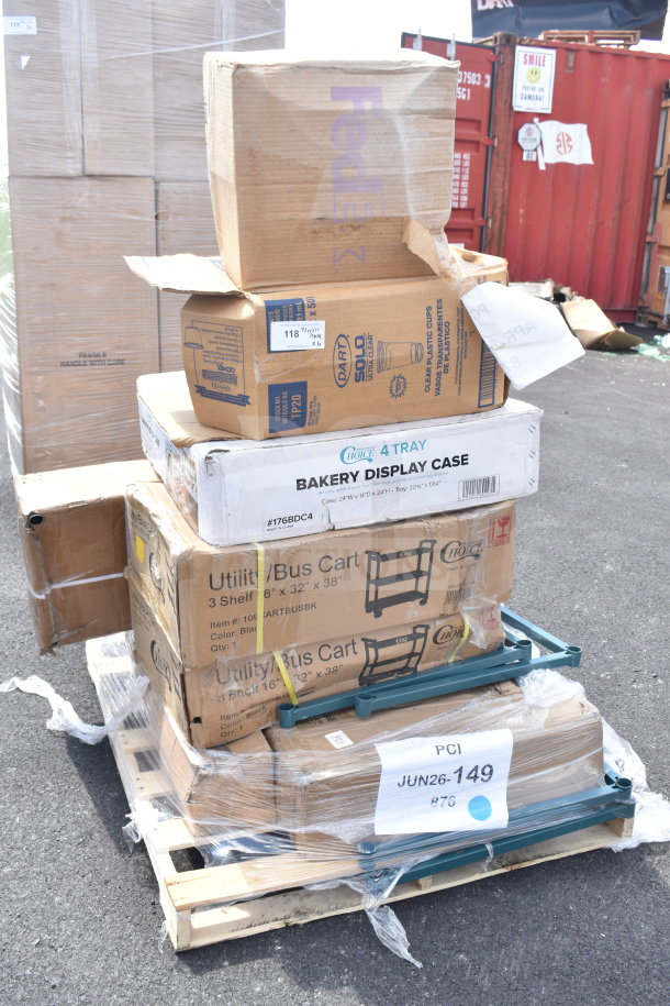 Stack of boxed items labeled "Utility/Bus Cart" and "Bakery Display Case" on pallet. New scratch and dent condition.