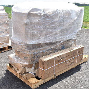 Pallet with six brand new items, including a folding chair and sink, wrapped in plastic. Boxes marked "Housekeeping Cart" and "Regency."