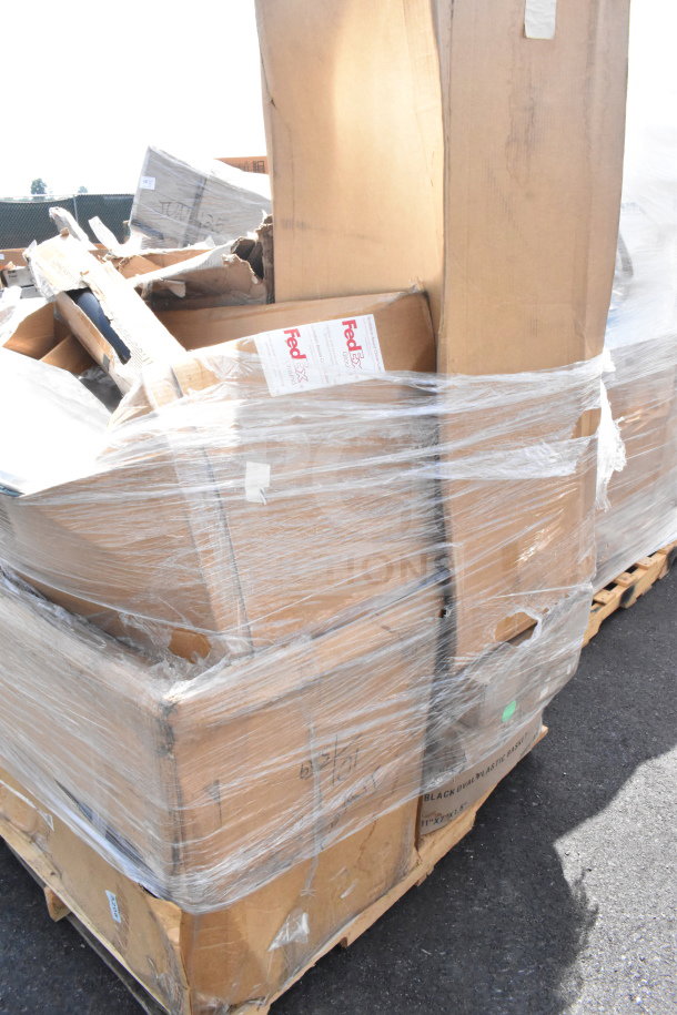 Pallet of 13 brand new scratch and dent items including table base column, wrapped in plastic, visible FedEx labels.