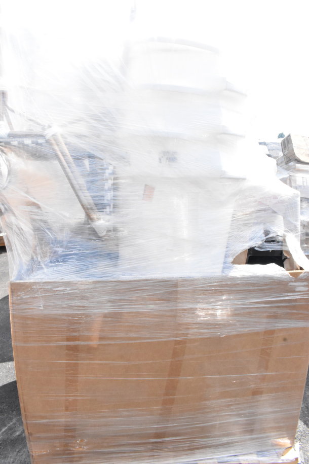 Shrink-wrapped pallet of 20 scratch and dent items, including trash can and stools. New condition, visible in partial cardboard box.