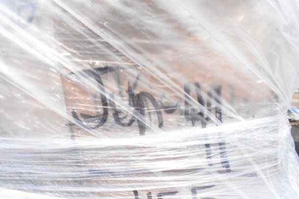 Plastic-wrapped pallet labeled "Jun-44" containing 8 brand new scratch and dent items for auction, condition unclear.