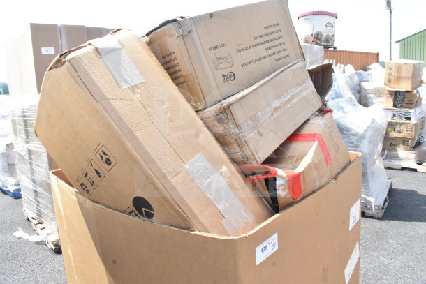 Cardboard boxes containing 18 new scratch and dent items, including tacos holder, fry pan, trash can, wrapped on a pallet.