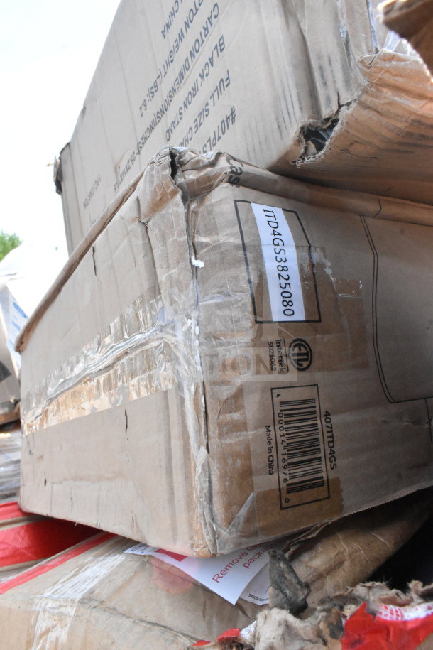 Damaged boxes of 18 new scratch and dent items, including taco holder and fry pan. Visible labels show model ITD4GS3825080.