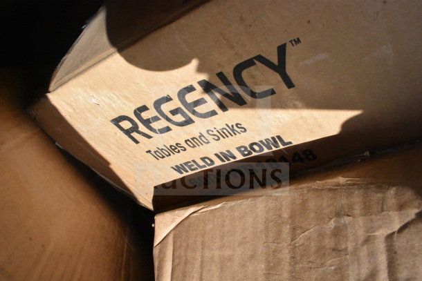 Cardboard box with the label "Regency Tables and Sinks, Weld In Bowl, 600SWB18148." Contains 18 new scratch and dent items.