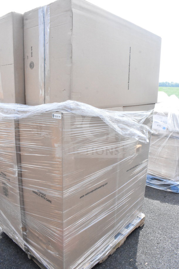 Pile of boxed scratch and dent Lancaster Table & Seating black stackable banquet chairs, silver vein frame, on pallet.