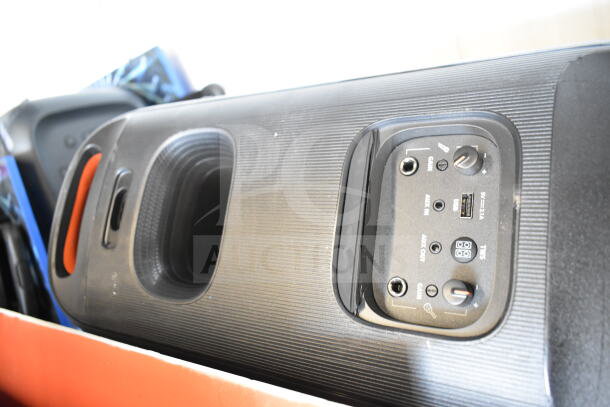JBL speaker with control panel, various input options, and a textured black exterior. Display model in excellent condition.