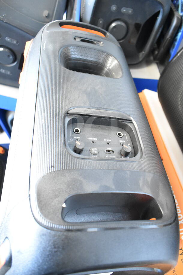 JBL speaker from store display, features aux input, USB port, and gain knobs. Slight wear visible on casing.