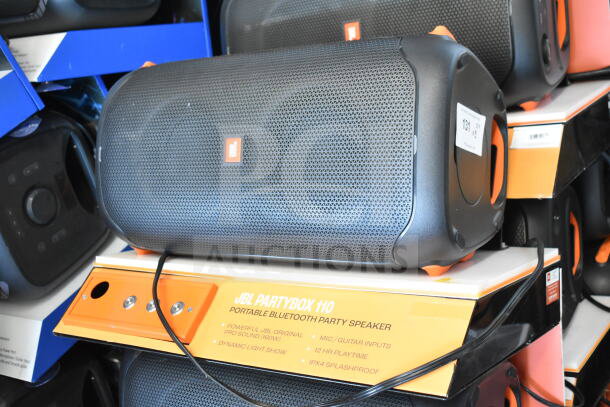 JBL PartyBox 110 portable Bluetooth speaker displayed on a store shelf. Features include Pro Sound, dynamic light show, and splashproof design.