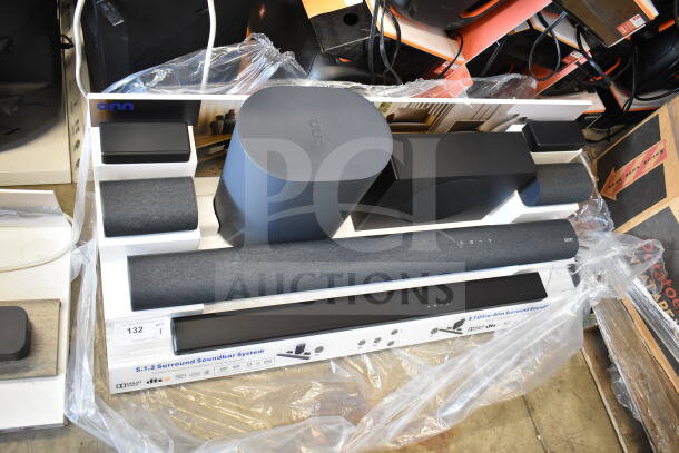 Onn 5.1.2 surround soundbar system store display, featuring soundbar, subwoofer, and satellite speakers, in excellent condition.