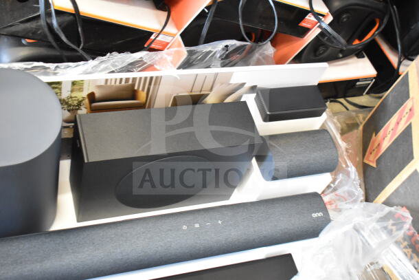 5.1.2 surround soundbar system on display, featuring sleek black design. Includes soundbar, subwoofer, and satellite speakers.