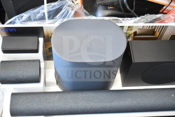 Store display featuring 5.1.2 surround soundbar system by Onn, showcasing multiple speakers and a subwoofer.