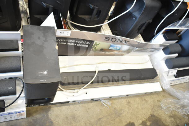 Sony store display featuring a soundbar and speaker, moderate wear, visible product signage, model HT-SD35.