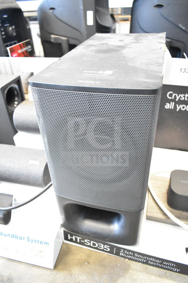 Sony HT-SD35 soundbar and speaker store display. Features Bluetooth technology. Visible labels highlight model and connectivity.
