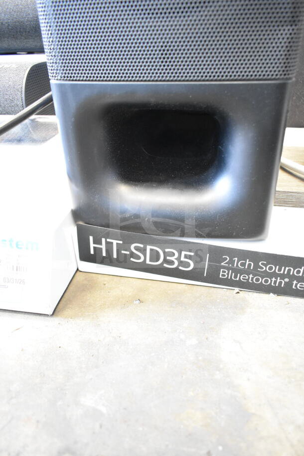 Store display featuring HT-SD35 2.1ch soundbar with Bluetooth, shown in like-new condition, ideal for showcasing audio equipment.