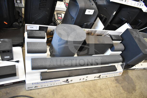 5.1.2 Surround Soundbar System store display, includes soundbar, subwoofer, speakers, in good condition, branded packaging visible.