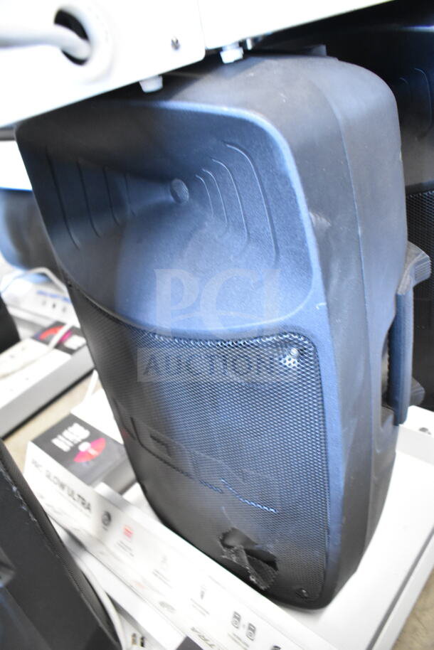 Pro Glow Ultra speaker on store display. Black, slightly worn. Includes original boxes, showcasing connectivity features.