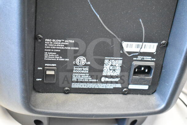 Pro Glow Ultra speaker with power switch, input rating details, and barcode label visible. Made by ION Audio LLC.