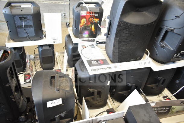 Display of five Ion Pro Glow Ultra speakers with packaging, featuring black design and labels indicating model and quantity.
