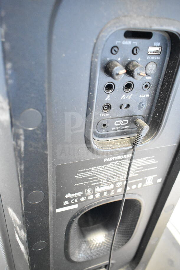 Back panel view of JBL Partybox 310 speaker, showing input ports and controls. Slight wear is visible.