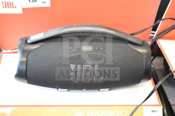 JBL Boombox 3 speaker in black, featuring a durable handle, visible brand logo, and control buttons. Store display model.