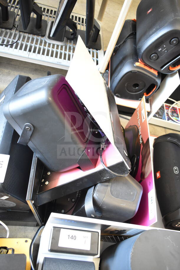 2 store display with Altec Lansing Shockwave speaker, visible controls, and packaging. Includes bid tags for auction.